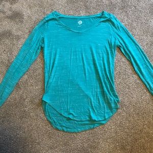 One blue and one pink long sleeved shirts